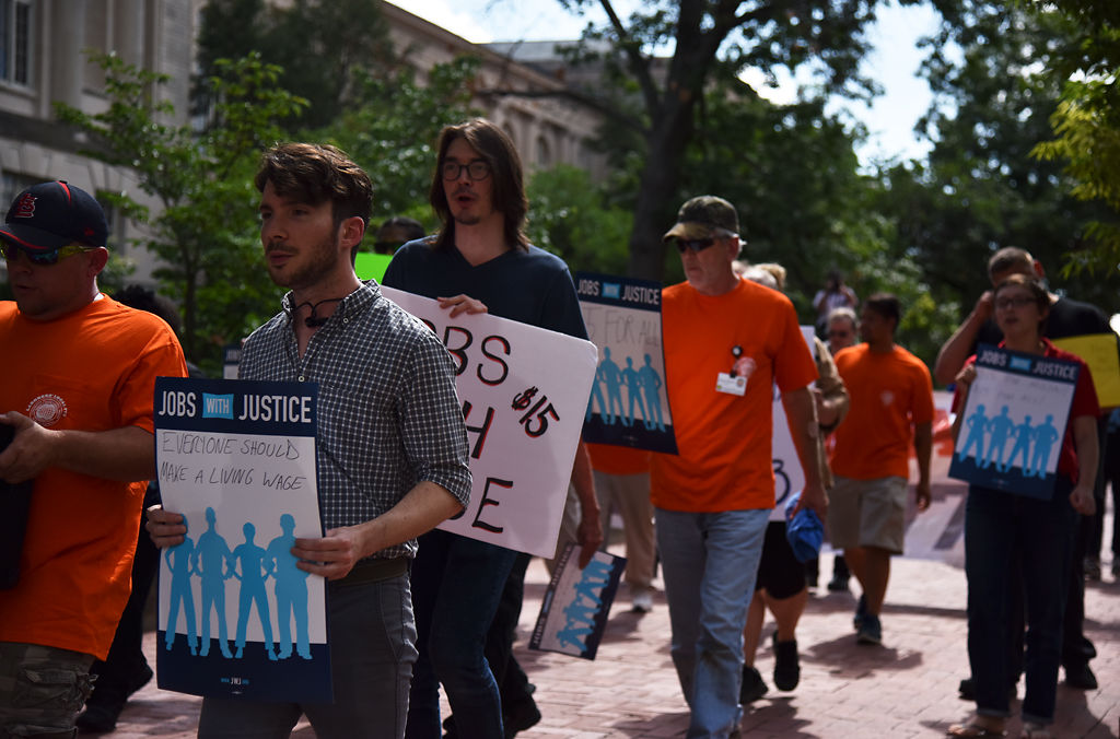 Rally participants walked and chanted from Traditions Plaza to Memorial Union
